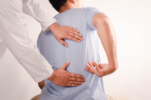 doctors doing physical therapy young men advise patient with back waist problems 73749 637 1